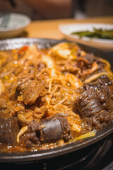 A serving of braised blood sausage with rich sauce flavor