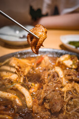 A serving of braised blood sausage with rich sauce flavor