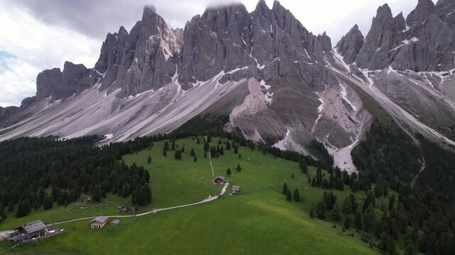 DRONE AERIAL FOOTAGE - The Odle Group is an impressive mountain range in the Dolomites, Bolzano, Trentino Alto Adige, Italy. The main peak of this massif is Mt. Sass Rigais.