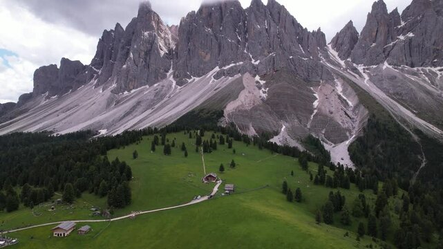 DRONE AERIAL FOOTAGE - The Odle Group is an impressive mountain range in the Dolomites, Bolzano, Trentino Alto Adige, Italy. The main peak of this massif is Mt. Sass Rigais.