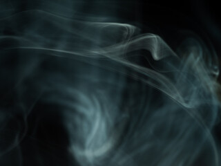 Blue wisps of smoke swirling