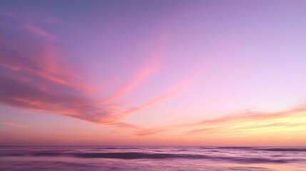 Fototapeta premium Pink And Purple Sunset Over Ocean Horizon