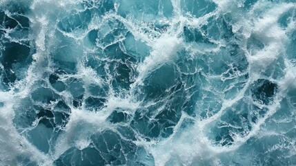 Obraz premium Turbulent Ocean Waves with Foam in Bright Tropical Waters