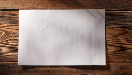 sheet of paper lying on wooden desk