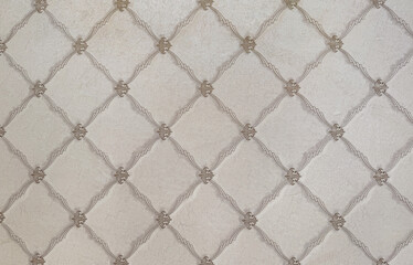 Close up of classic wall paper in beaded lace pattern forming diamond floral shape. Random diamond elegant modern classic wallpaper seamless background texture