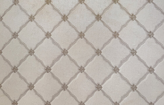 Close up of classic wall paper in beaded lace pattern forming diamond floral shape. Random diamond elegant modern classic wallpaper seamless background texture