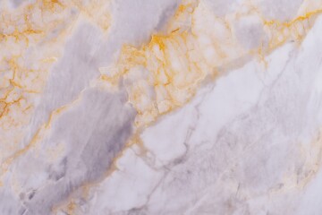 Naklejka premium Elegant marble surface with gold veins and white background texture