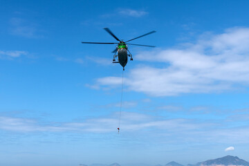 flying helicopter in the blue sky