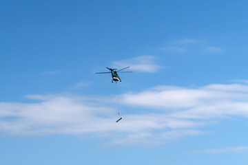 flying helicopter in the blue sky