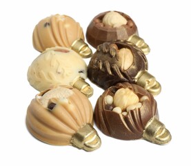 Delicious chocolate in shape of Christmas baubles isolated on white