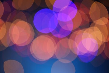 Blurred view of colorful lights on dark blue background, bokeh effect