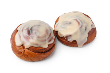 Tasty cinnamon rolls with cream isolated on white