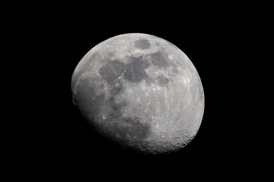 Waxing gibbous moon against a black background.