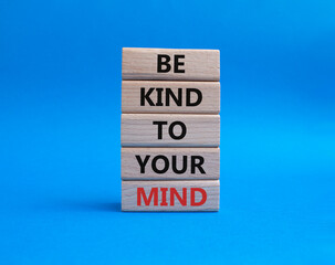 Be kind to your Mind symbol. Wooden blocks with words Be kind to your Mind. Beautiful blue background. Business and Be kind to your Mind concept. Copy space.