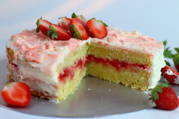 Buttermilk strawberry cake with rose pink icing and flower petal effect