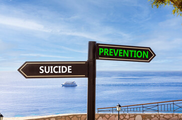 Obraz premium Suicide prevention symbol. Concept words Suicide prevention on beautiful road sign. Beautiful blue sky and clouds background. Psychological suicide prevention concept. Copy space.