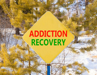 Addiction recovery symbol. Concept words Addiction recovery on beautiful yellow road sign....
