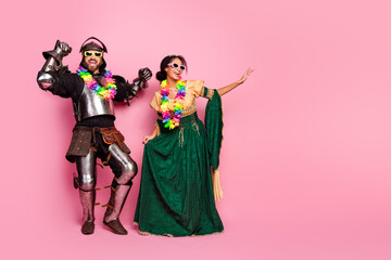Fun theme party image featuring a knight and a princess in medieval costumes on a bright pink...