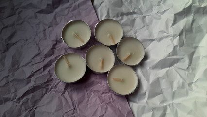 Tealight candle on a wrinkled surface