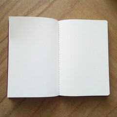 New blank notebook, pristine white pages, spiral bound, lines, studio, texture