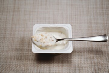 Yogurt with Granola on Spoon