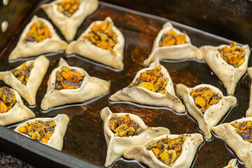 Sweet pastries triangular gomentashi ears of aman for the holiday of Purim