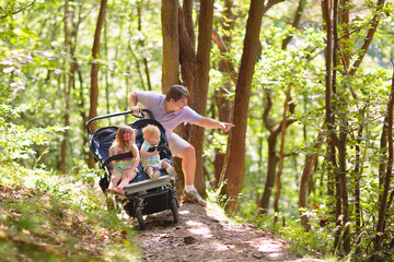 Father with children in all terrain stroller