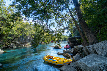 View of Koprulu Canyon. Boat for rafting on the Koprucay river with turquoise cold water.  Antalya, Turkey. Popular tourist attraction. © Vlad Rakin