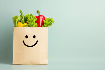 Smiling paper shopping bag with fresh vegetables, copyspace