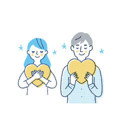 ハートを持っている笑顔の若いカップル