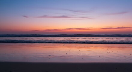 Ocean Beach at Dusk with Colorful Sky and Water Reflection