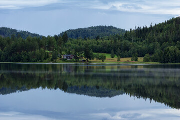 Small wooden summer houses by the lakeside in the north of Sweden