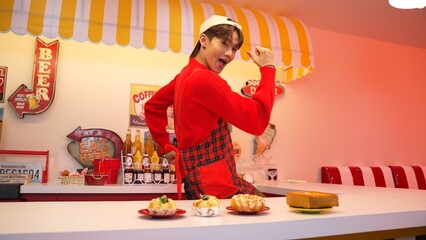 Professional asian restaurant worker prepare food and standing behind food bar. Happy waiter with...
