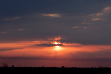 Romantic beauty of sunset casts a warm, golden glow over the horizon, creating a serene and captivating moment that enchants lovers and dreamers alike