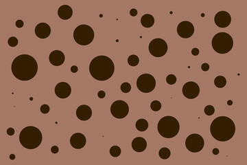 A light brown background with lots of small brown circles. The circles are of different sizes and are scattered all over the background.