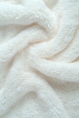 Soft white fabric draped elegantly creating a cozy and inviting texture for any home decor setting