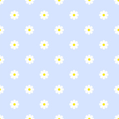 Obraz premium Seamless pattern of small daisies on a pastel blue background