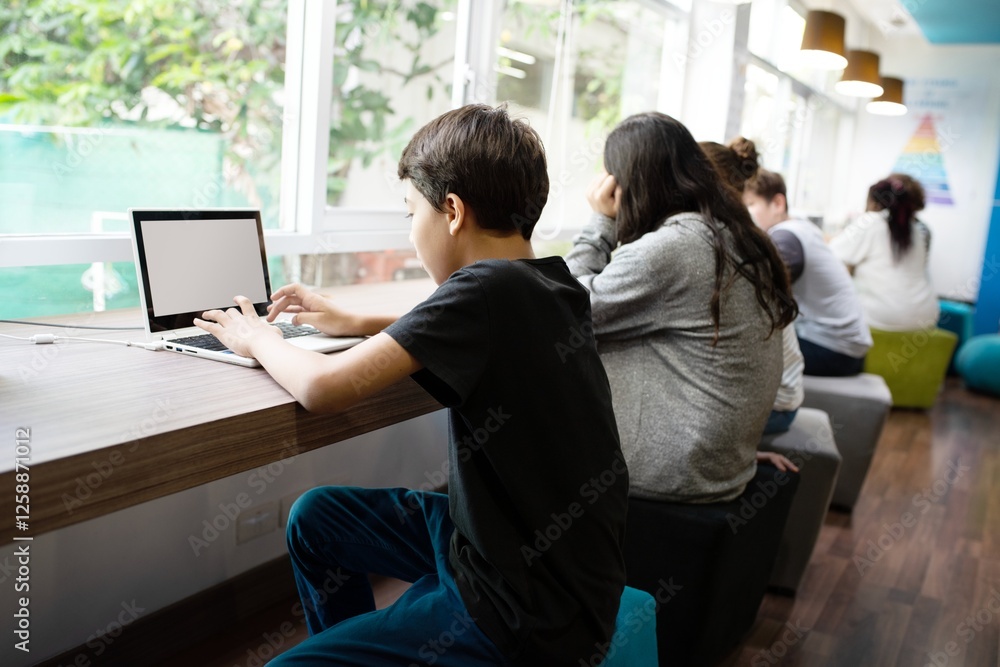 Aufkleber students studying in a modern library. young people focused on laptops. diverse group learning in a 
