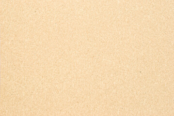 A sheet of beige recycled cardboard texture as background