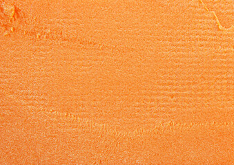 Orange expanding foam texture surface as background	