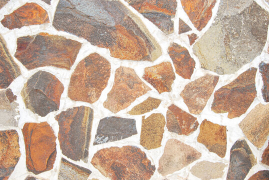 Natural rubble stone wall texture as background