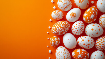 A collection of intricately designed eggs boasts vibrant orange patterns, beautifully laid against a lively orange backdrop