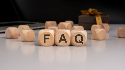 Wooden blocks spelling 'FAQ'