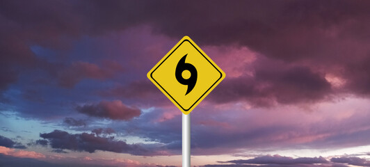 danger,caution,Hurricane Idalia warning sign against a powerful stormy background with copy space. Dirty and angled sign with cyclonic winds add to the drama.hurricane season sign on cloudy background