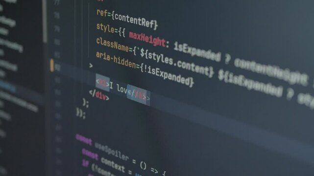 Typing "I love HTML" in code editor, console. Technology background for software developer and Computer script concept. Programming React.js, Next.js, JavaScript, HTML. Close up video