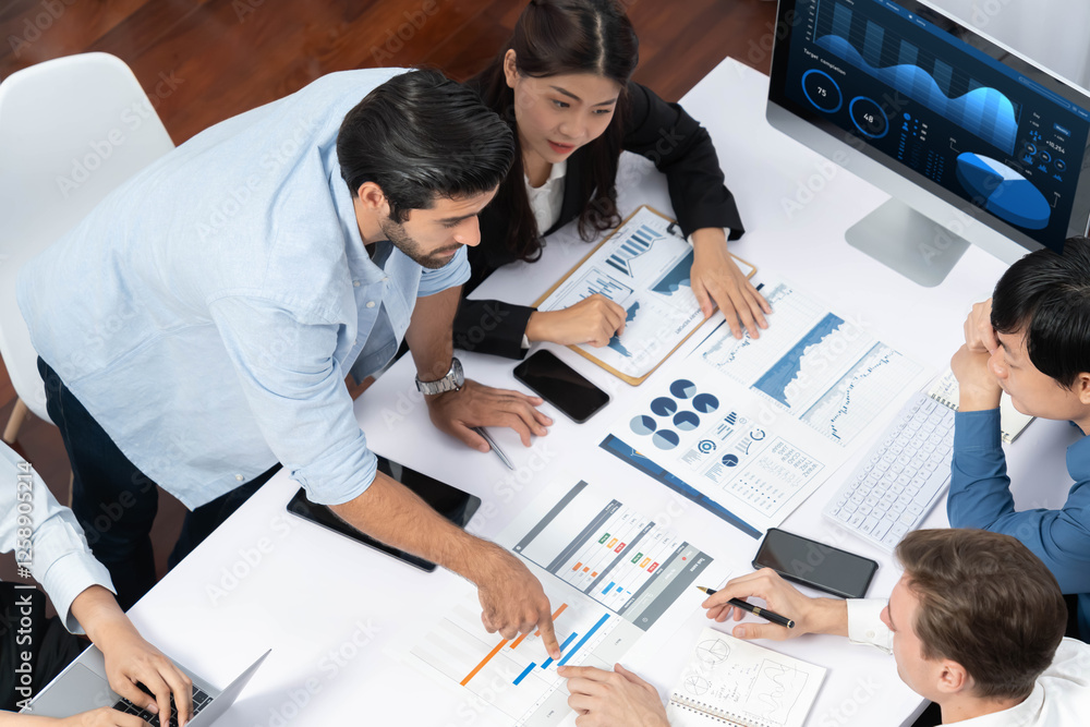 Fototapete Project manager communicate and collaborate with team using project management software display on monitor, tracking progress of project task and making schedule plan at meeting table. Prudent