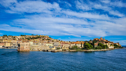 Fototapeta premium Beautiful panoramic view from the sea to the ancient Mediterranean Italian city of Portoferraio on Elba Island.
