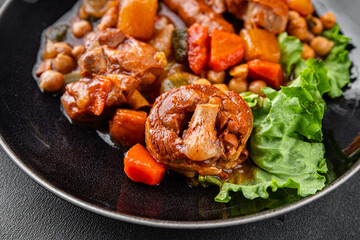 Ragout meat, sausages, vegetables stew dish fresh tasty food delicious gourmet food background on the table rustic food top view copy space