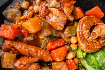 Ragout meat, sausages, vegetables stew dish fresh tasty food delicious gourmet food background on the table rustic food top view copy space