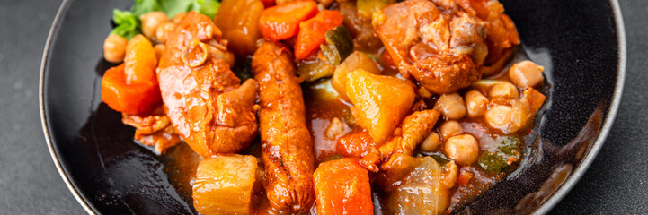 Ragout meat, sausages, vegetables stew dish fresh tasty food delicious gourmet food background on the table rustic food top view copy space